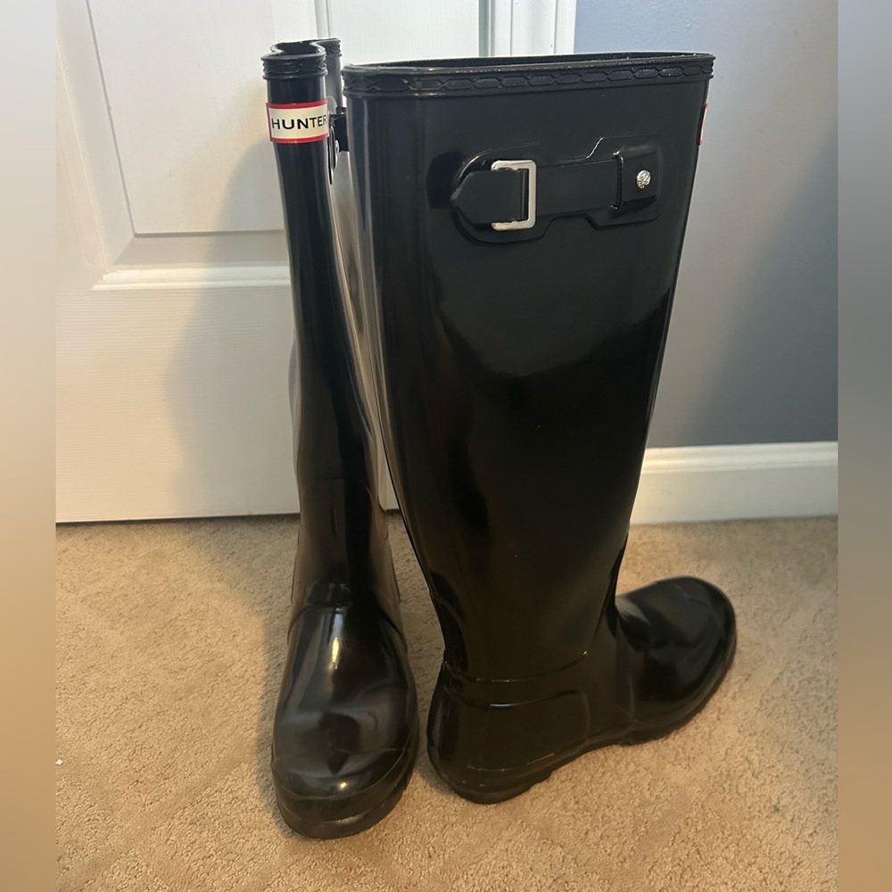 Black tall hunter boots